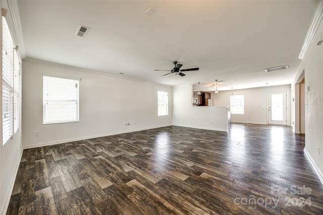 unfurnished living room featuring ornamental molding, dark hardwood / wood-style floors, and ceiling fan