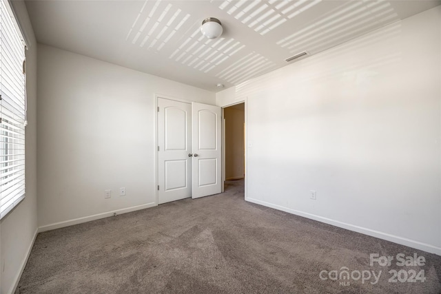 empty room featuring carpet floors