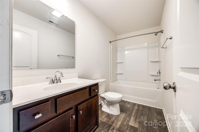 full bathroom with shower / tub combination, hardwood / wood-style floors, vanity, and toilet