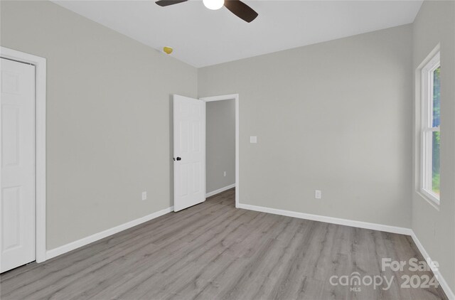 spare room featuring ceiling fan and hardwood / wood-style flooring