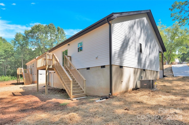 view of side of home with cooling unit