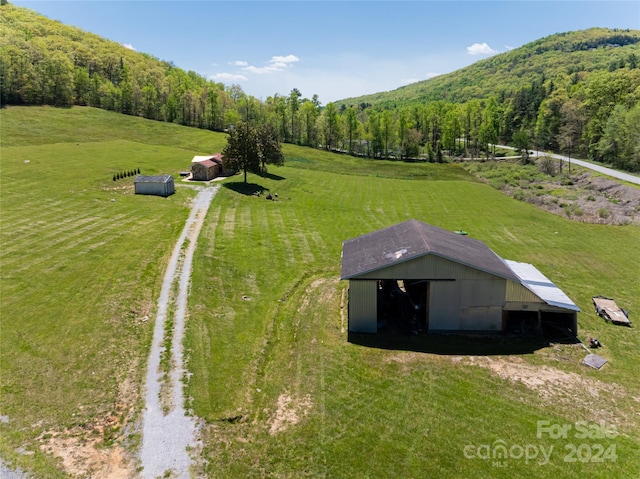 birds eye view of property featuring a rural view