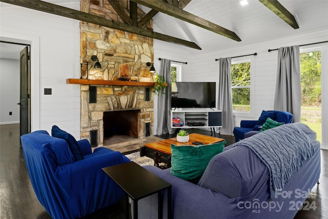 living room with dark hardwood / wood-style flooring, lofted ceiling with beams, a stone fireplace, and wood walls