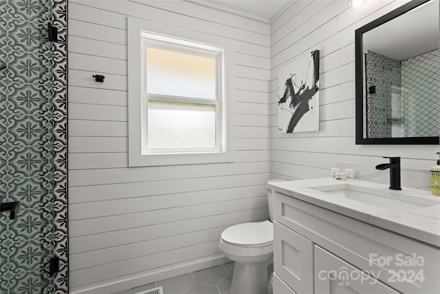 bathroom with tile patterned floors, vanity, and toilet