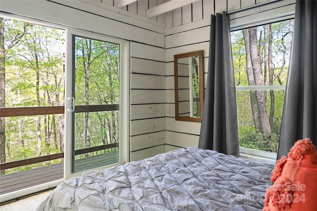 bedroom with wooden walls