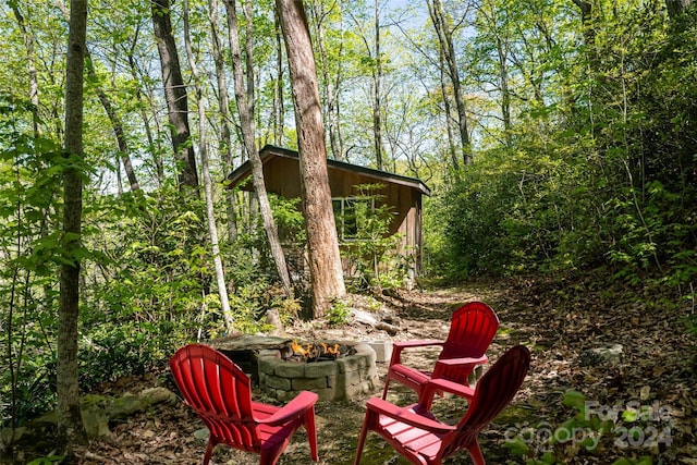 view of patio with a fire pit