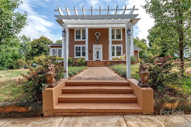 view of front facade featuring a pergola