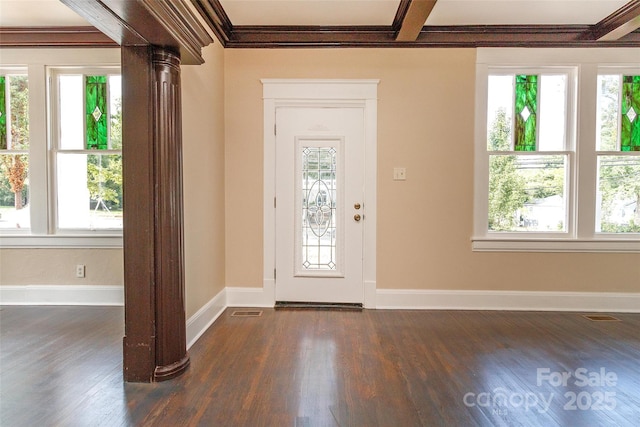 entryway featuring dark hardwood / wood-style floors, crown molding, and plenty of natural light