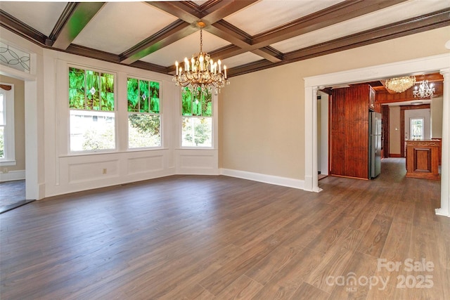 unfurnished room with beam ceiling, coffered ceiling, an inviting chandelier, and dark wood-type flooring