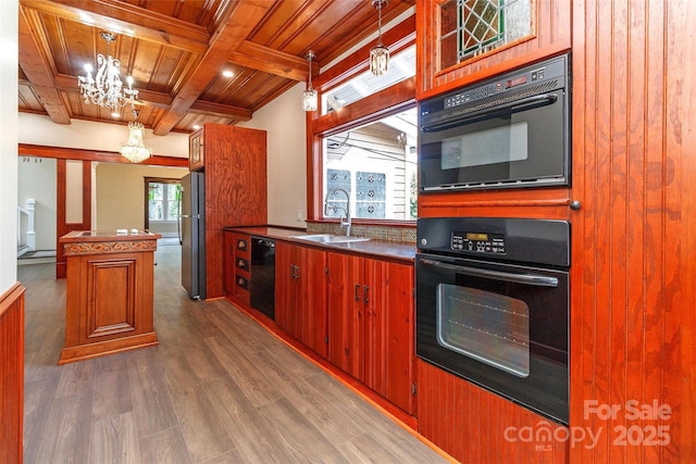 kitchen featuring pendant lighting, black appliances, wood ceiling, dark hardwood / wood-style flooring, and sink