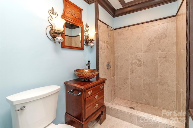 bathroom featuring sink, toilet, and a tile shower