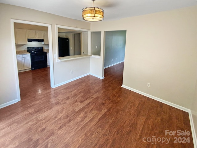 unfurnished dining area with wood-type flooring