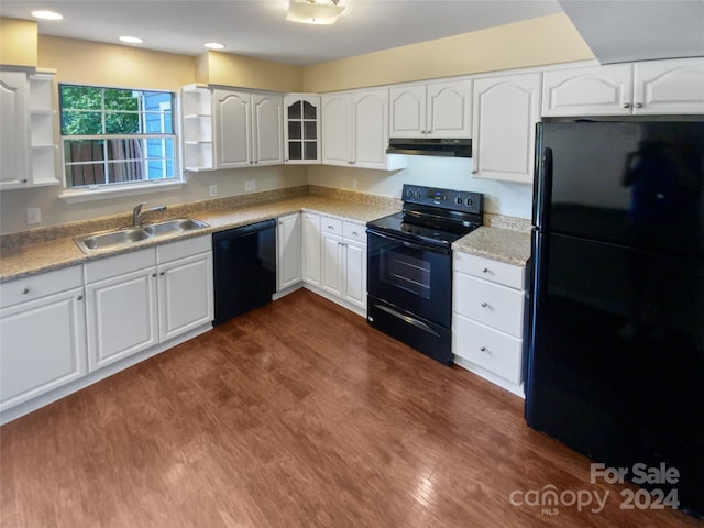 kitchen featuring white cabinets, dark hardwood / wood-style flooring, sink, and black appliances