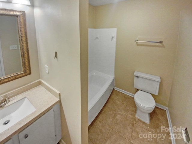 bathroom with tile patterned flooring, vanity, a bathtub, and toilet