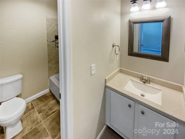 bathroom with vanity and toilet