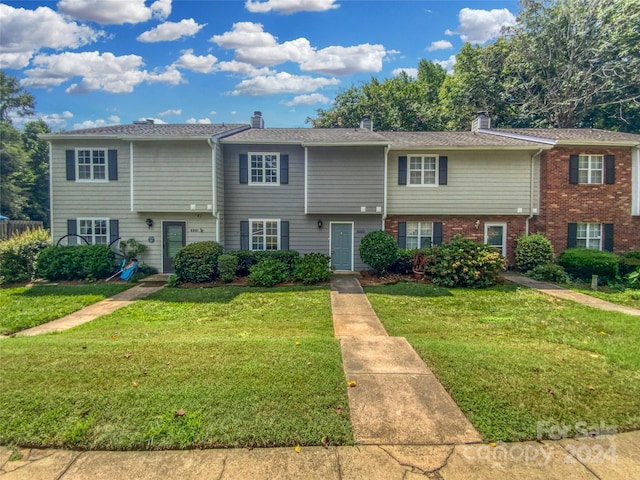 view of front of home with a front lawn