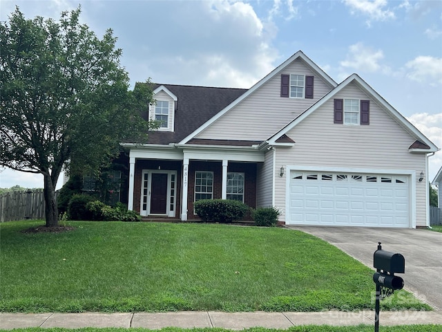 view of front of house with a garage and a front yard