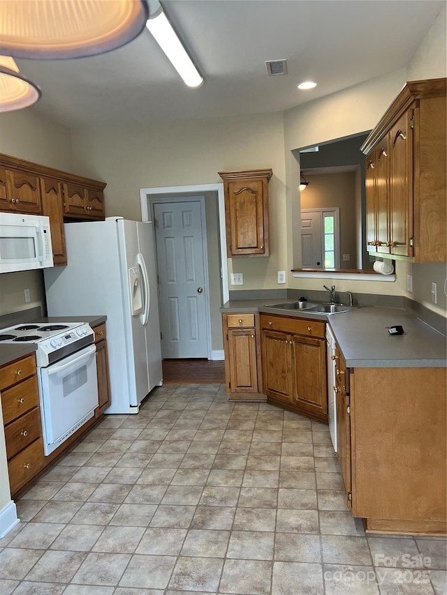 kitchen with sink and white appliances