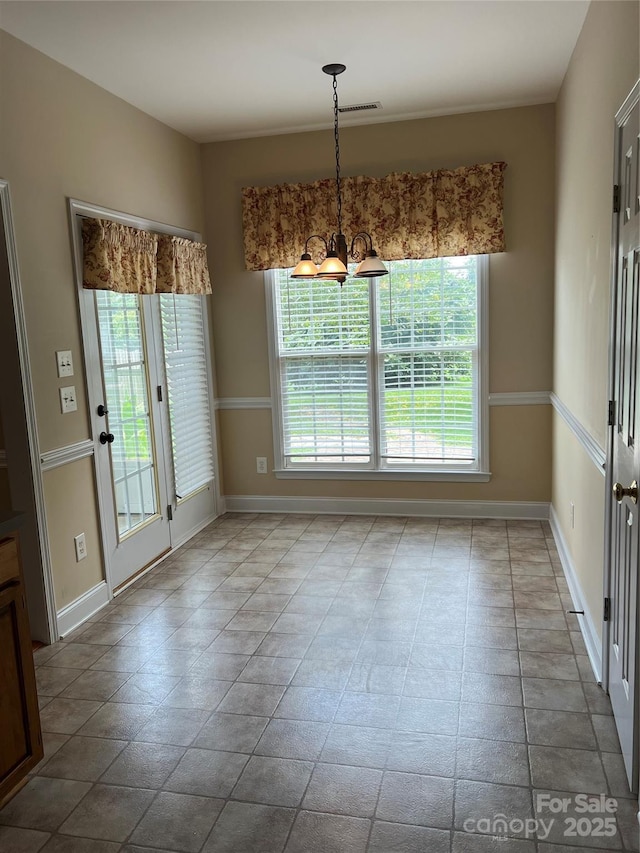 interior space featuring a chandelier and a wealth of natural light