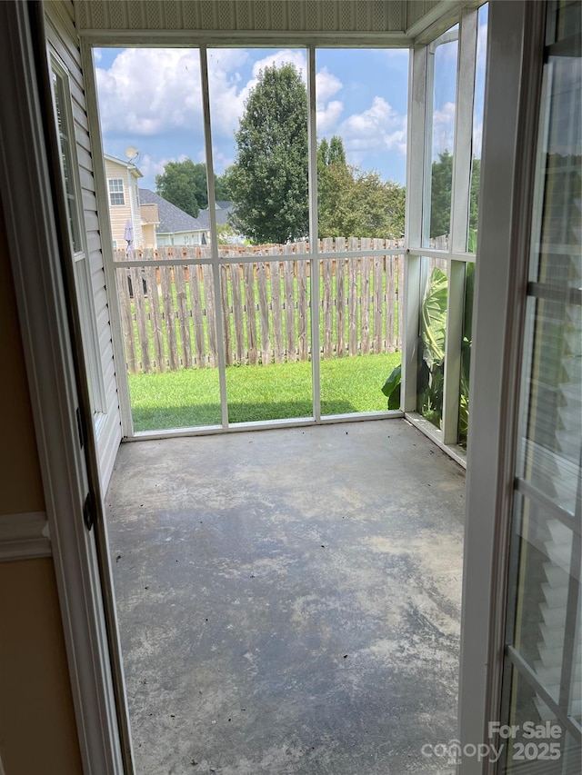 unfurnished sunroom featuring a healthy amount of sunlight