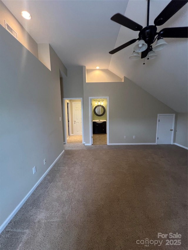 bonus room with carpet floors, ceiling fan, and vaulted ceiling