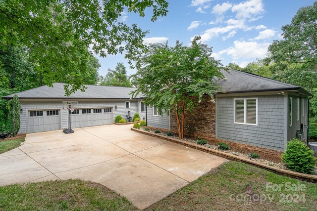 ranch-style house featuring a garage