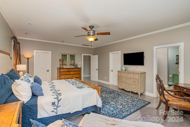 bedroom featuring wood-type flooring, ornamental molding, and ceiling fan