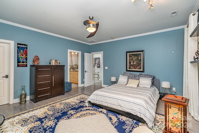 bedroom with crown molding, ensuite bath, and dark hardwood / wood-style floors