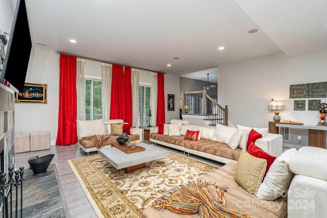 living room featuring a fireplace and hardwood / wood-style flooring