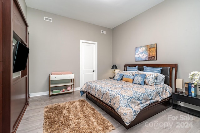 bedroom with light wood-type flooring