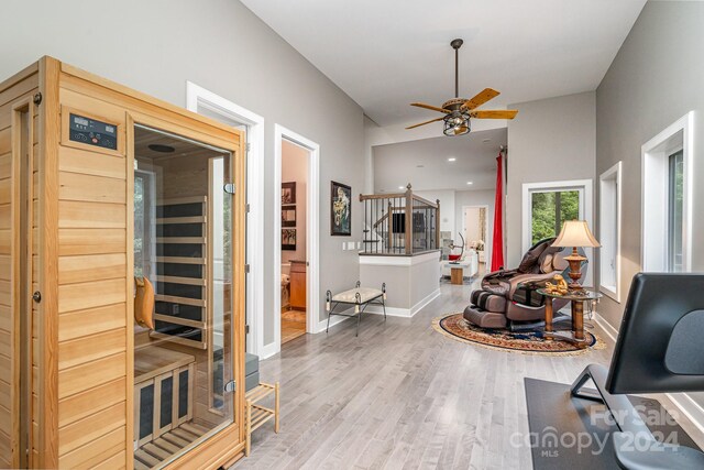 living room featuring hardwood / wood-style flooring and ceiling fan