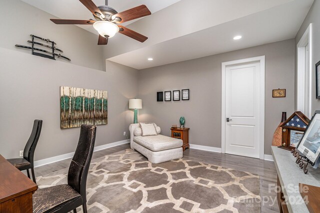 office space featuring wood-type flooring and ceiling fan