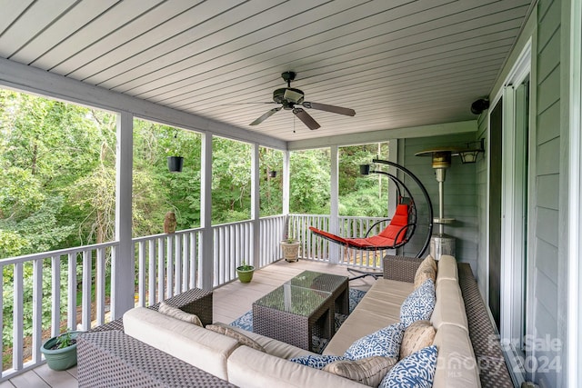 wooden deck featuring an outdoor hangout area and ceiling fan