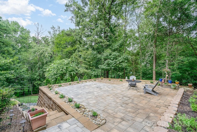 view of patio / terrace with an outdoor fire pit