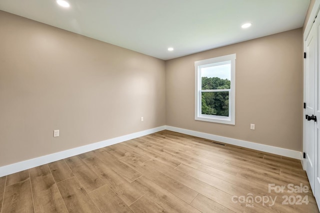 unfurnished room featuring light wood-type flooring