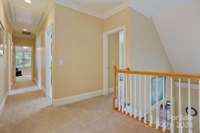 hall with light carpet and crown molding