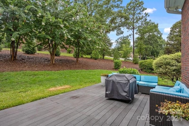 deck featuring grilling area, a yard, and outdoor lounge area