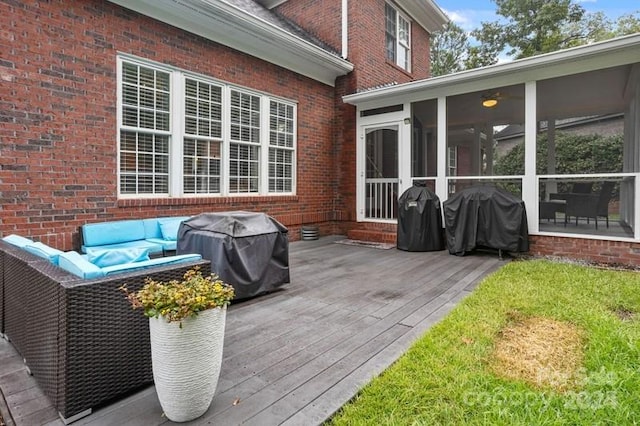 deck featuring area for grilling, a sunroom, and an outdoor hangout area