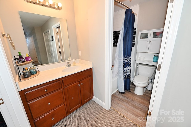 full bathroom with vanity, shower / tub combo, and toilet