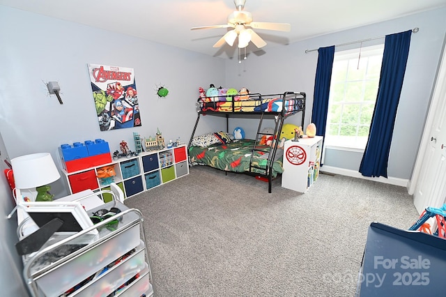 carpeted bedroom with ceiling fan