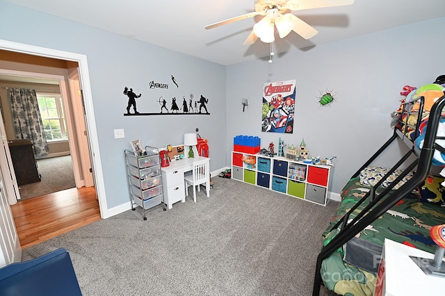 game room with ceiling fan and carpet