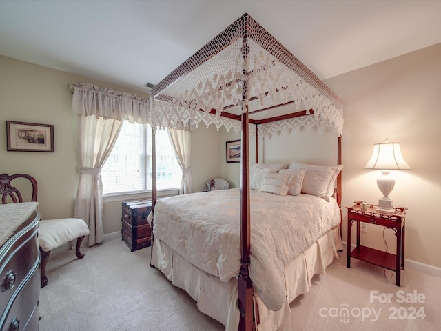 bedroom with light colored carpet