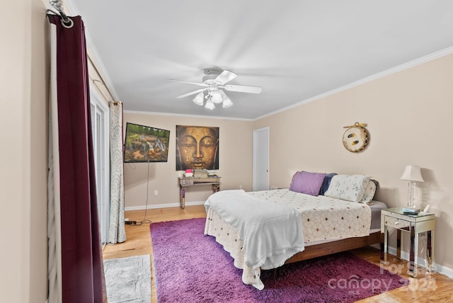 bedroom featuring a ceiling fan, baseboards, ornamental molding, and wood finished floors