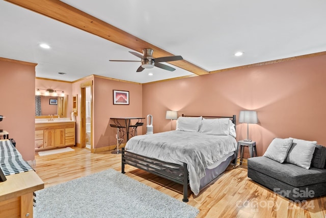 bedroom with baseboards, crown molding, beamed ceiling, and light wood-style floors