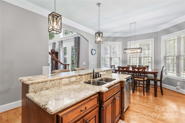 kitchen with light hardwood / wood-style flooring and a healthy amount of sunlight