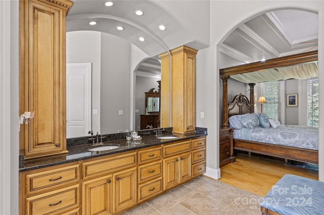 bathroom featuring ornamental molding, tile patterned floors, decorative columns, and double vanity