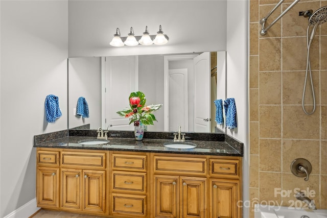 bathroom featuring tiled shower / bath combo and dual bowl vanity