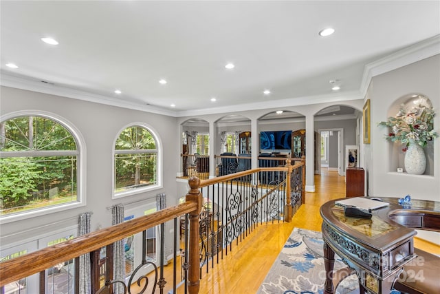 hall featuring crown molding and light wood-type flooring