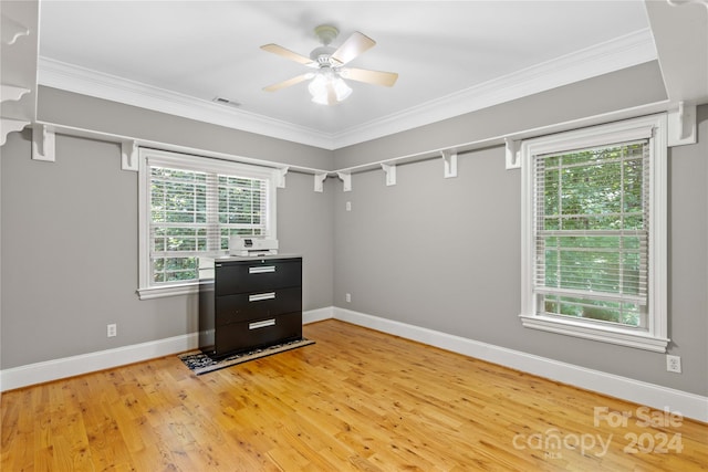 unfurnished room featuring light hardwood / wood-style flooring, a healthy amount of sunlight, and ceiling fan