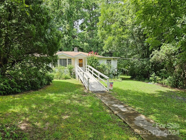 ranch-style house with a front lawn